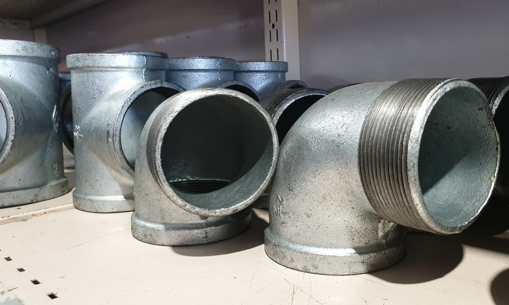 Galvanised fittings on a shelf