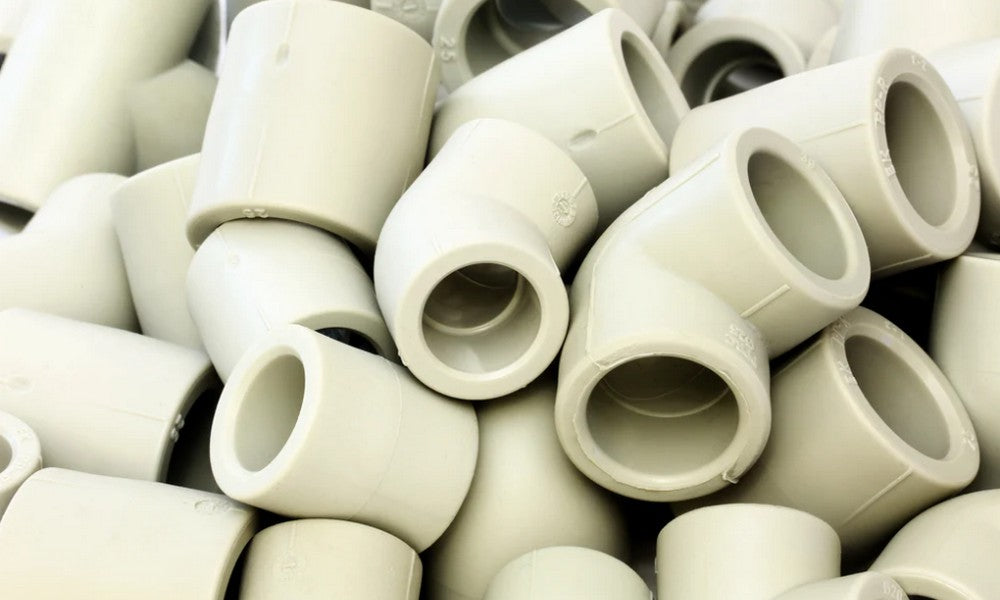A pile of PVC fittings. 