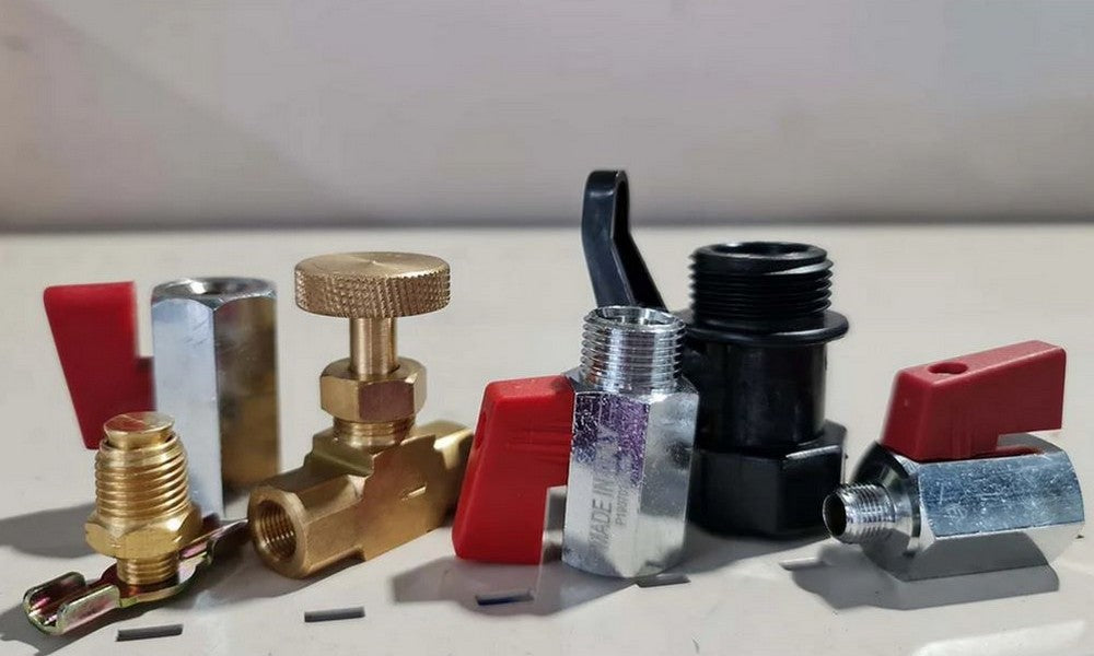 A collection of mini valves on a shelf in various colours and metals.