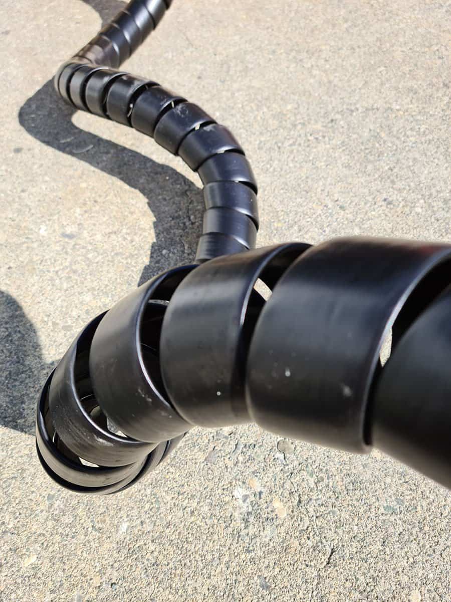 Black PVC spiral-wrap hose guard
