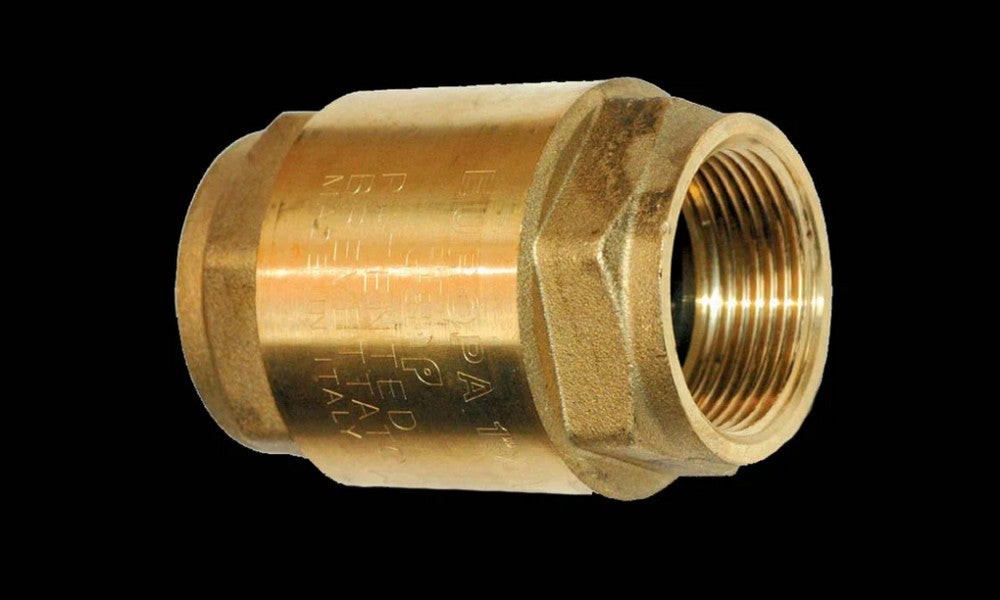 A brass one-way or check valve on a black background.
