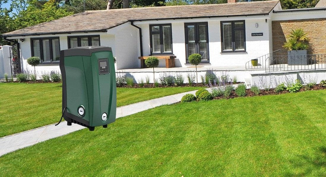 DAB Esybox pump with house and lawn in background