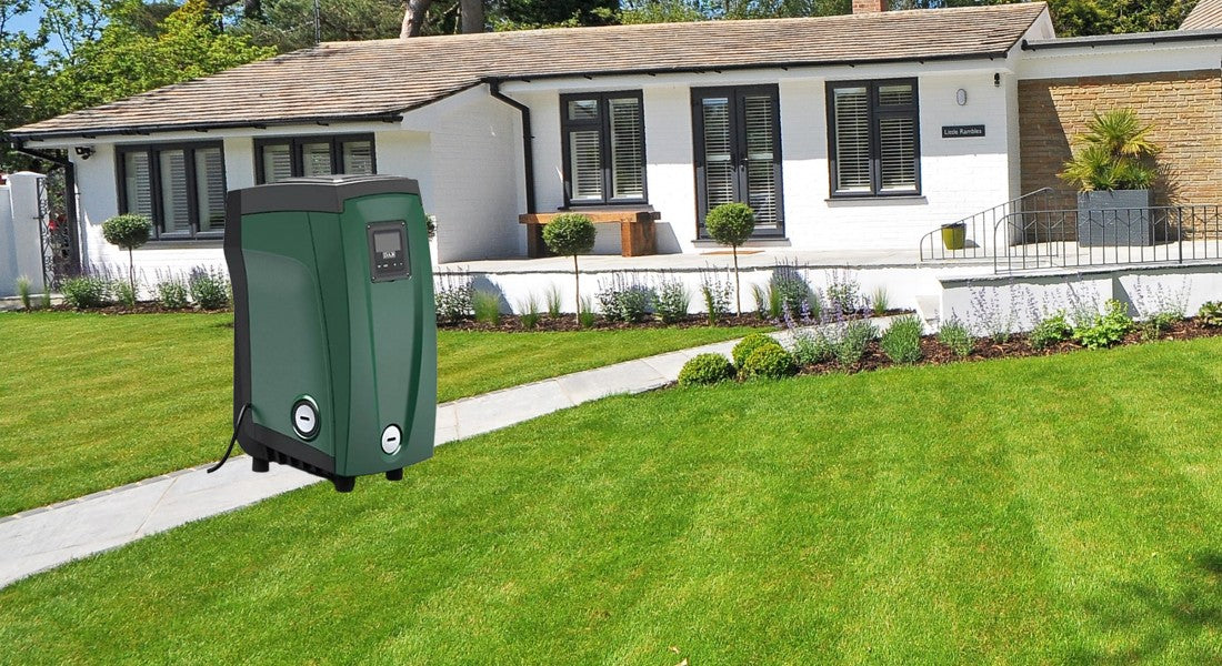 DAB E.SYBox pump in front of house with green lawn