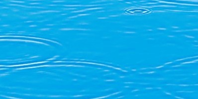 Blue water with round ripples on surface