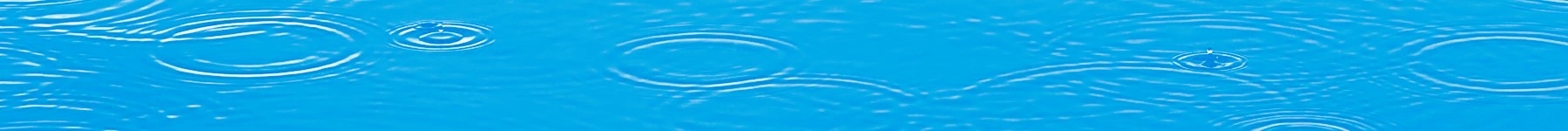 Blue water with round ripples on surface